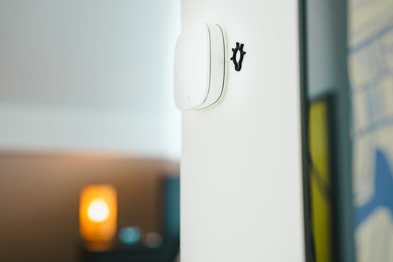 our-experience A sleek smart home light switch installed on a wall, showcasing modern technology in living spaces.